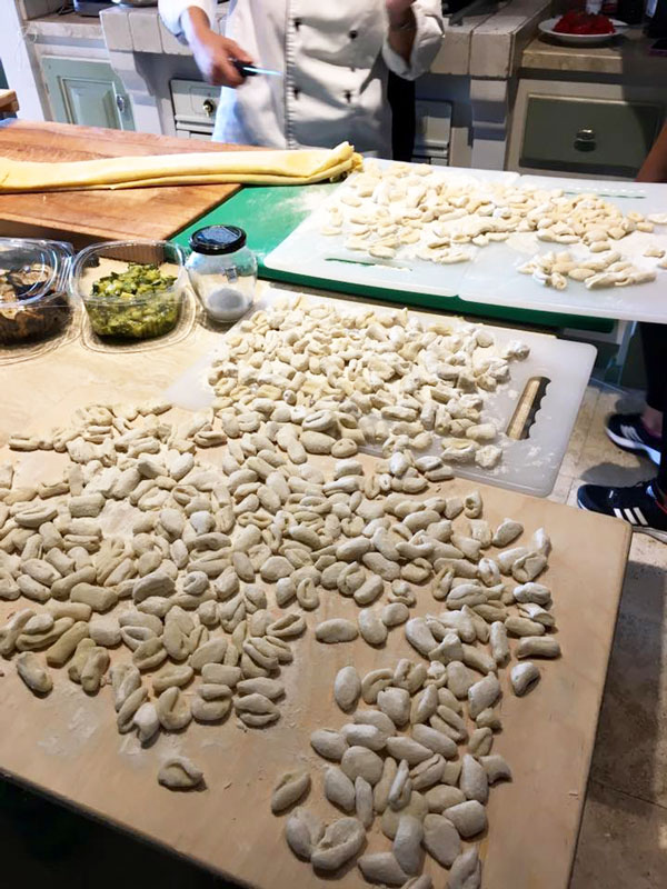 Boards of homemade pasta in a kitchen