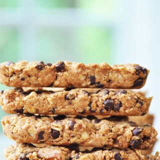 Granola bars stacked on a white surface