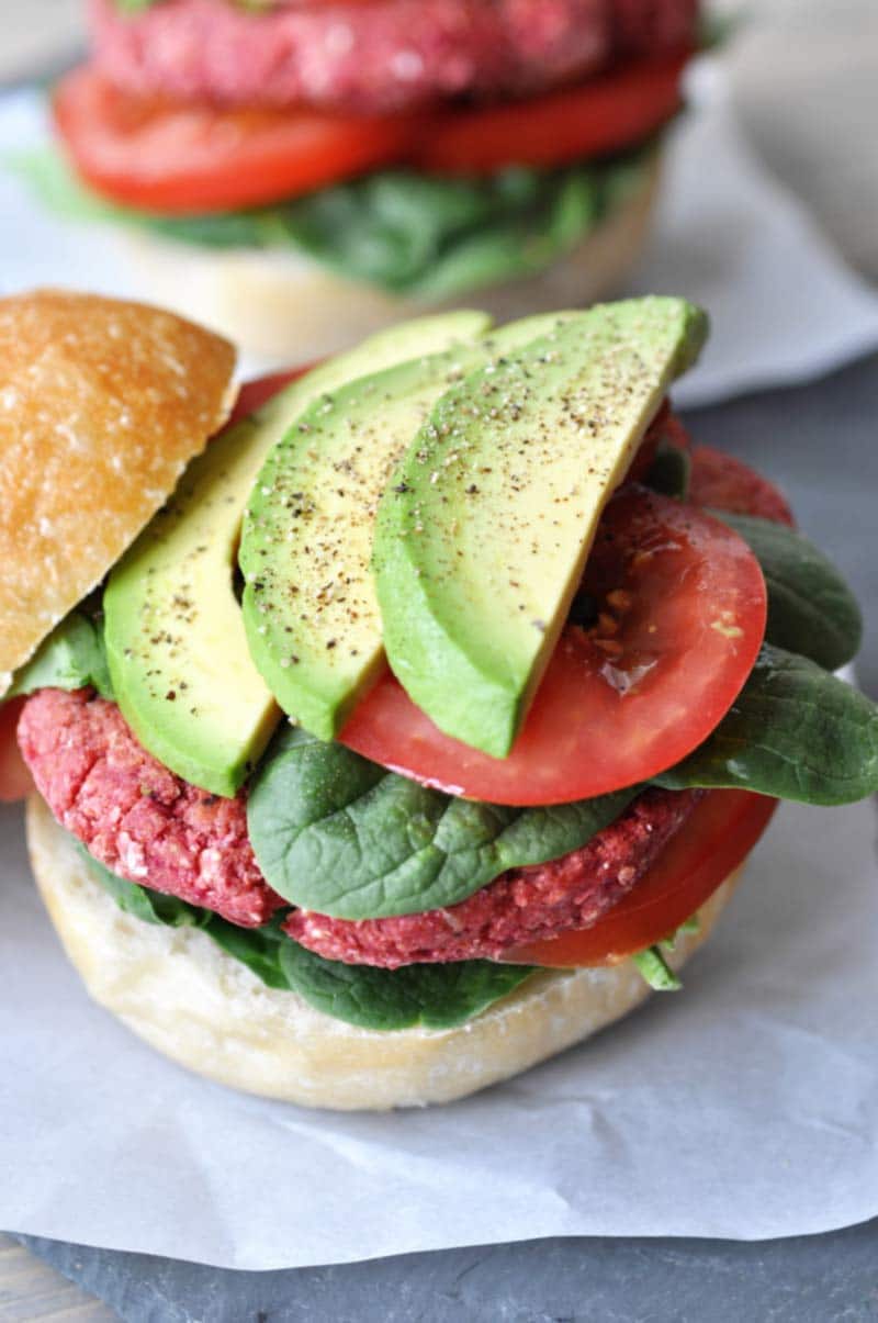 Vegan Beet Burgers that Won't Fall Apart on the Grill! This veggie burger recipe is made with aquafaba. It;s the perfect binder, and it holds the burger together like nothing else does. www.veganosity.com