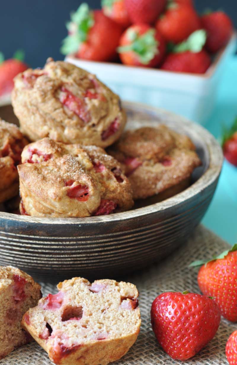 Vegan Whole Wheat Strawberry Muffins! This healthy and delicious recipe is bursting with fresh seasonal strawberries and nutty whole wheat flour. You have to try them. www.veganosity.com