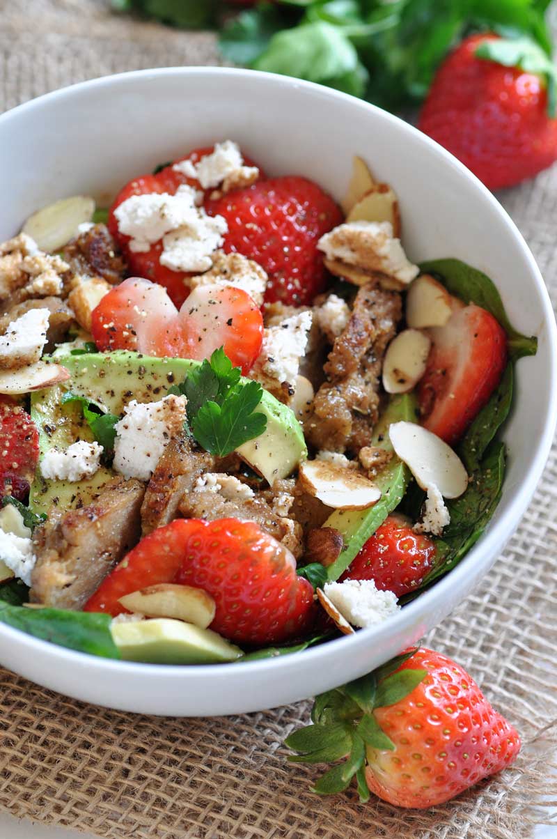Fresh strawberries, avocado, spinach, and seitan chicken salad! Healthy, vegan, and dairy-free, perfect for a quick lunch.