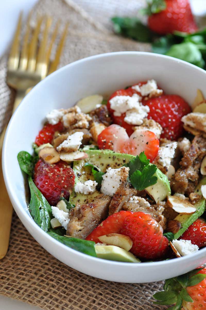 Fresh strawberries, avocado, spinach, and seitan chicken salad! Healthy, vegan, and dairy-free, perfect for a quick lunch.