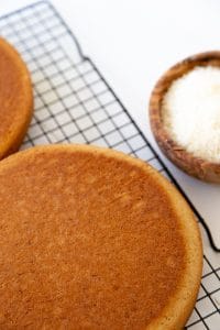 process shot of two cakes cooling on a wire rack