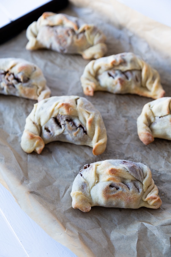 A tray of baked empanadas