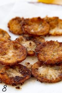 Fried lemons on a white paper towel.
