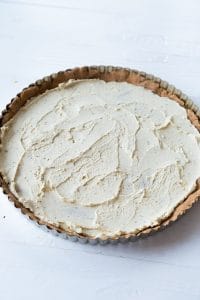 Cheese spread over a crust in a tart pan