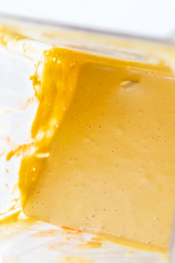 A creamy cheese sauce in a blender jar.