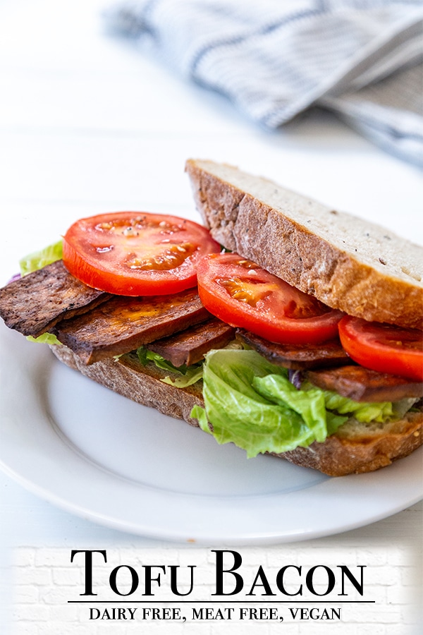 A Pinterest pin for tofu bacon with a picture of a vegan BLT sandwich on a white plate. 