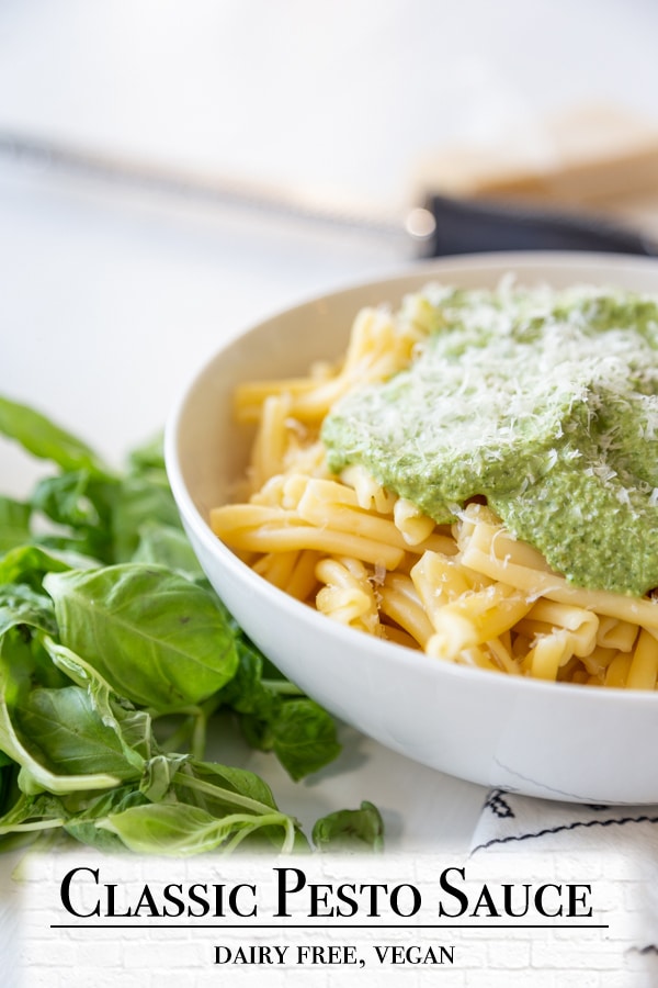 A Pinterest pin for vegan pesto with a picture of pasta and pesto.