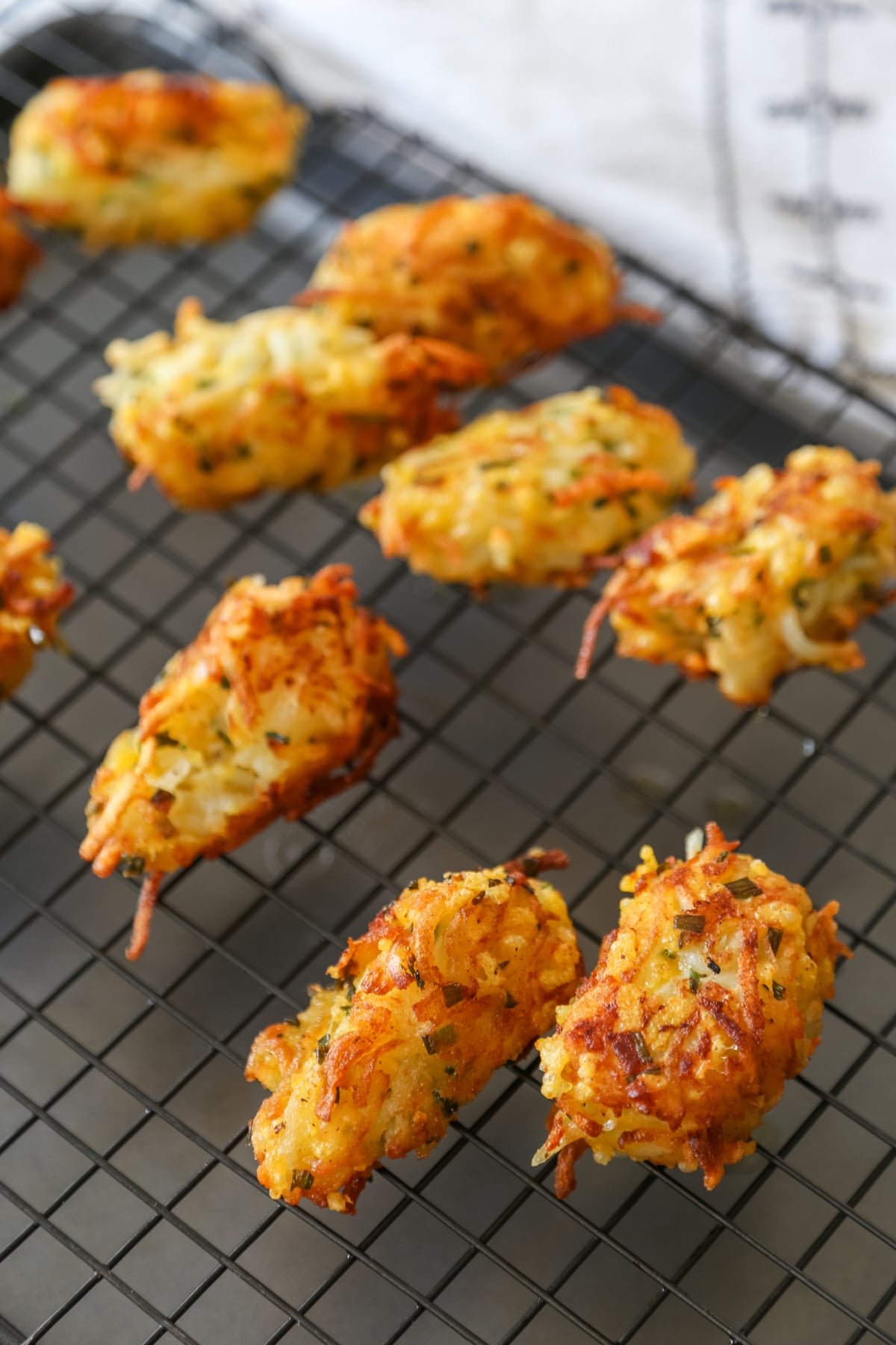 Tater tots on a wire rack.