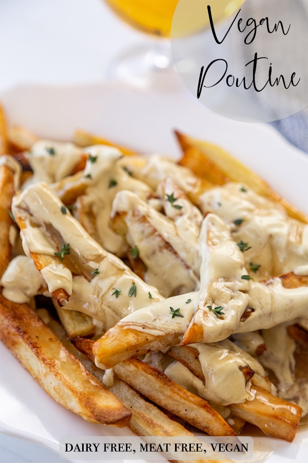 A Pinterest pin for vegan poutine with a picture of a white oval platter of the fries, gravy, and cheese sauce.