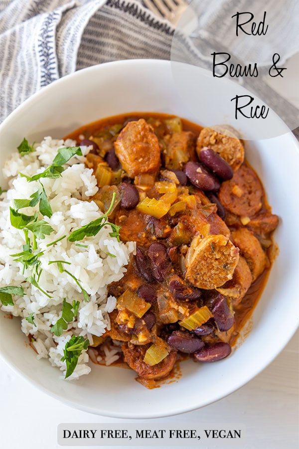 A Pinterest pin for vegan red beans and rice with a picture of a white bowl with half rice and half red beans and sausage.